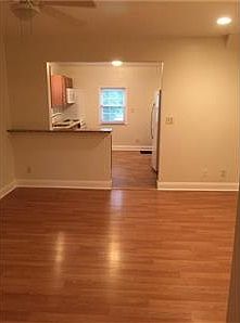 Dining Room wtih Laminated Hardwood & Breakfast Bar area