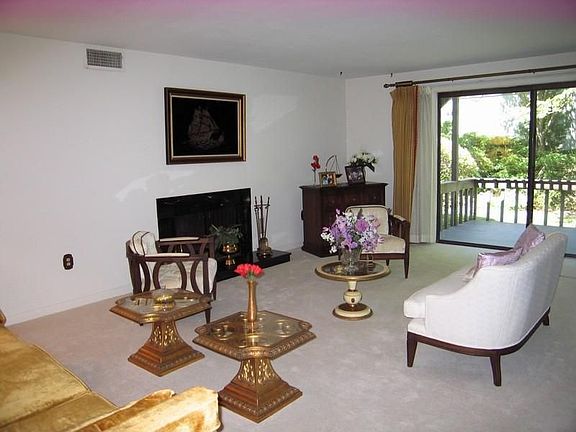 Living Room With Sliders to Private Deck