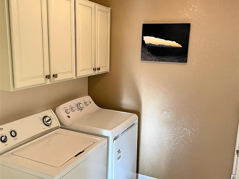Separate Laundry room that is spacious with cabinetry inside the home!