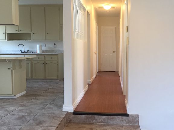 Hallway to three bedrooms