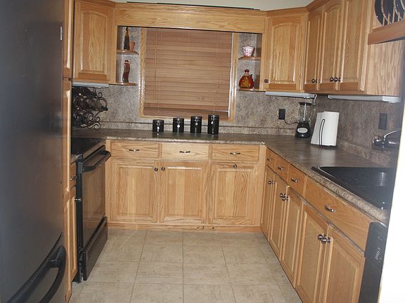 Ceramic tile and tons of cabinets.