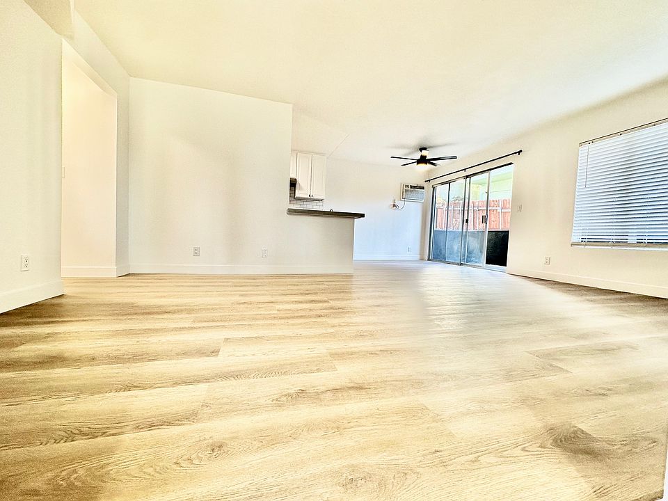 Open Concept Living Room/Dining Room/Kitchen opening onto an Extra Large Balcony with Views!