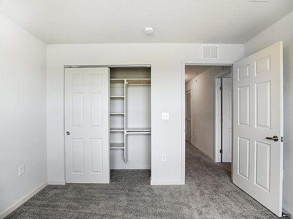 Bedroom featuring Spacious Closet with Organizers