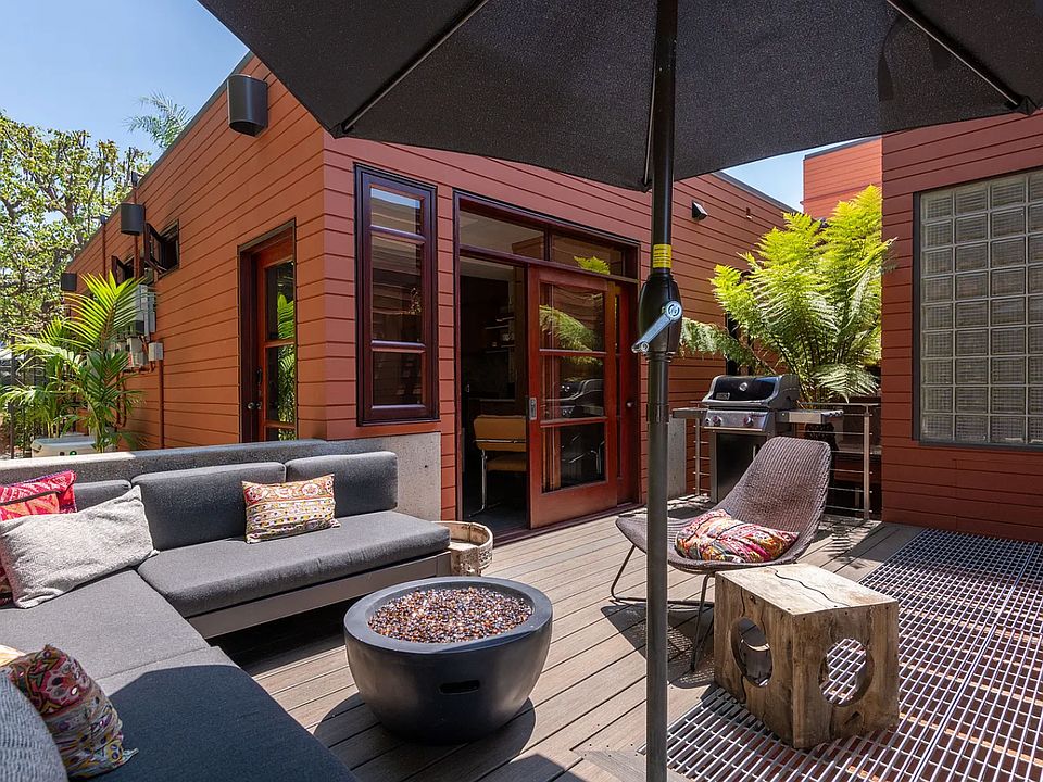 Private deck with large sectional, gas fire pit and gas BBQ, outdoor storage available under the deck