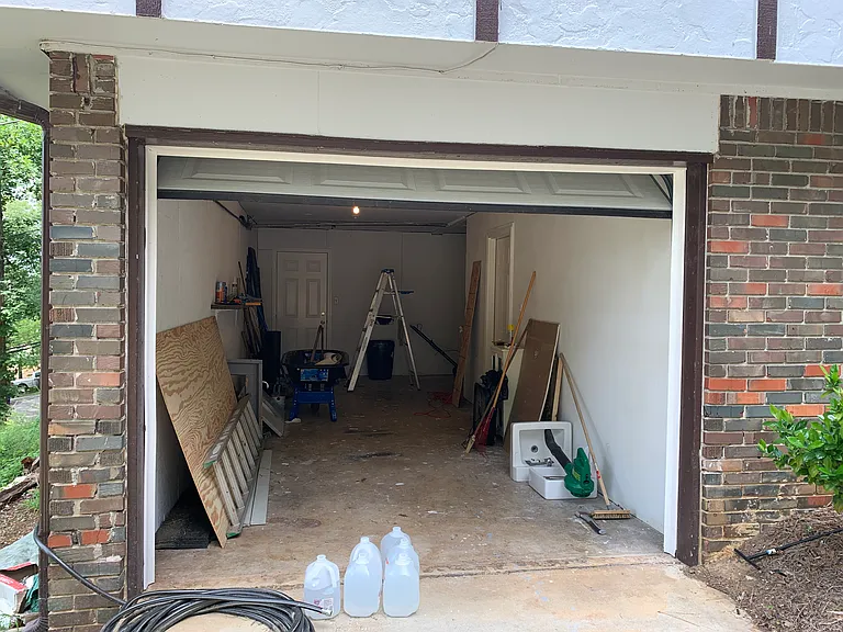 L- shaped garage contains laundry hook-ups.