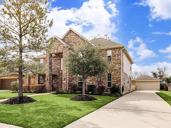The long driveway will allow for many cars to be parked here. Lots of room for overnight guests to park their vehicles. Every angle of the exterior of this home shows careful maintenance.