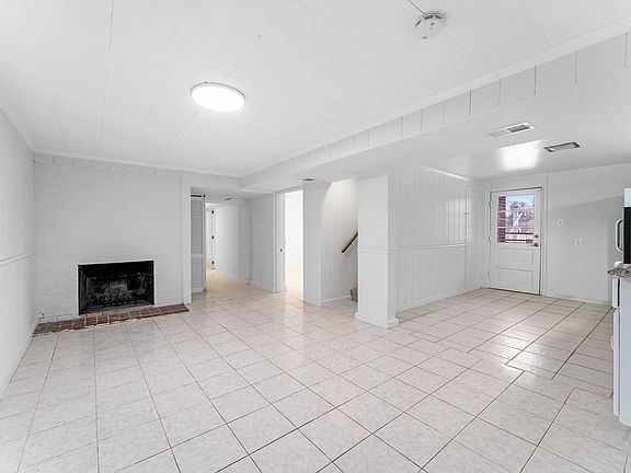 Large living room with decorative fireplace!