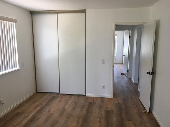 Looking from second bedroom into short hallway