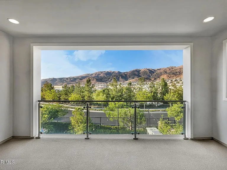 Master bedroom balcony with a view of the mountains