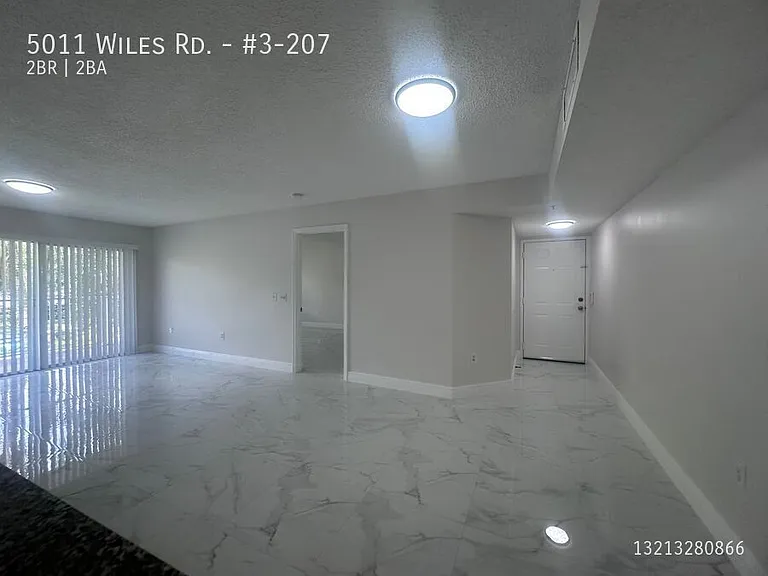 5011 Wiles Rd #3-207 — Photo 2