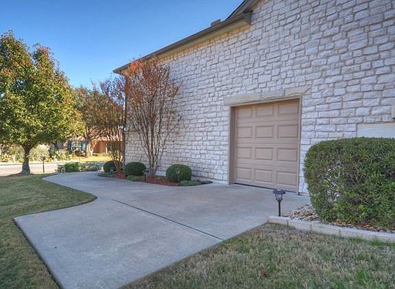 A full-stone exterior and Side-Entry Golf Cart Garage make this pleasing Sun City Texas Travis Premier Home one to see and enjoy.
