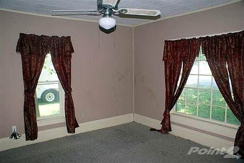 Bedroom has the original tall base boards.