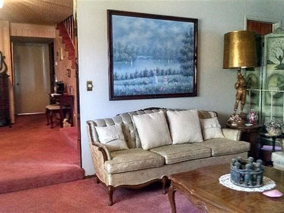 Relax, chat with a friend in the beautiful light in this living room.