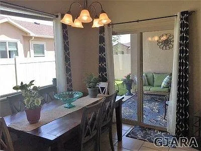 Dining area looking to outdoor sitting nook