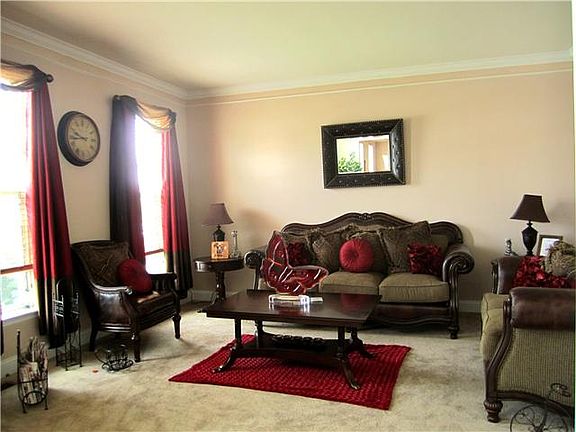 Formal living room with custom molding & neutral d