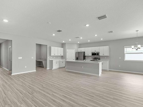 Enjoy a light-filled, open-concept living area - Aubrey II by Highland Homes