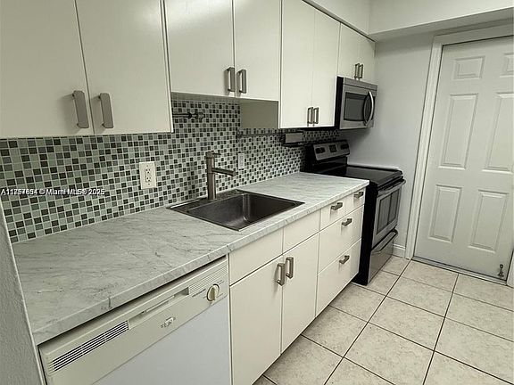 2nd image of 9971 W Bay Harbor Dr APT 205