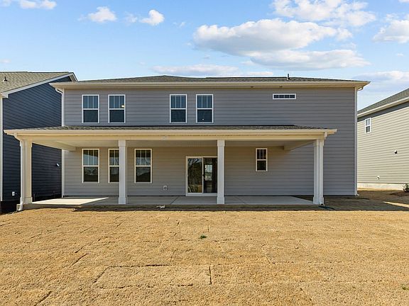 Norris Design expansive rear covered porch. At Lakeside Glen by premier builder DRB Homes in York, S