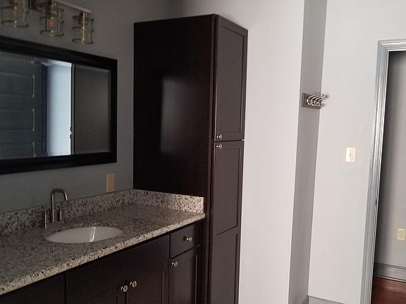 Bath area ... lots of cabinets. Not shown is a closet in the hallway that can be use linen closet or extra storage.