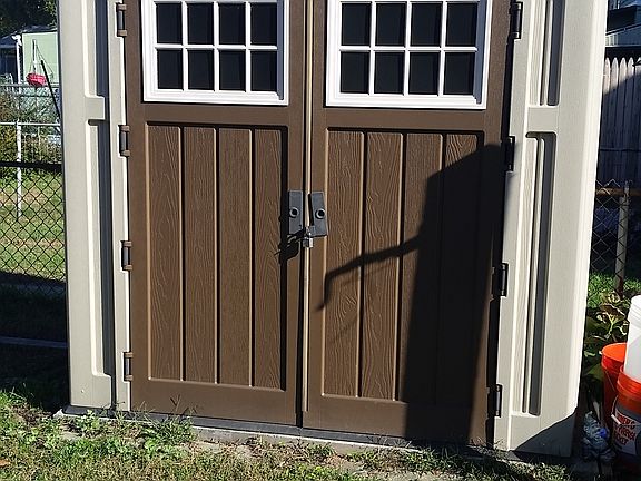 storage shed in fenced yard