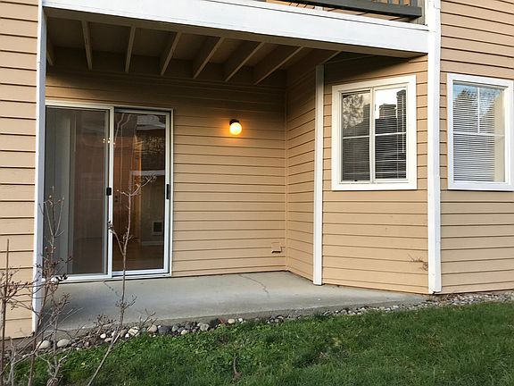 Back patio with sliding door and screen.