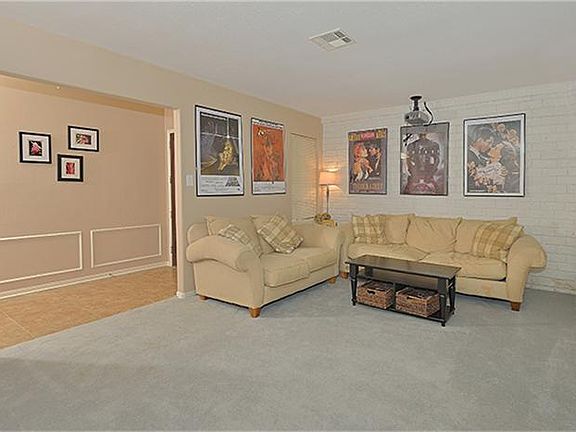 Large living room is presently being used as a media room. Media wiring and speakers are in place.