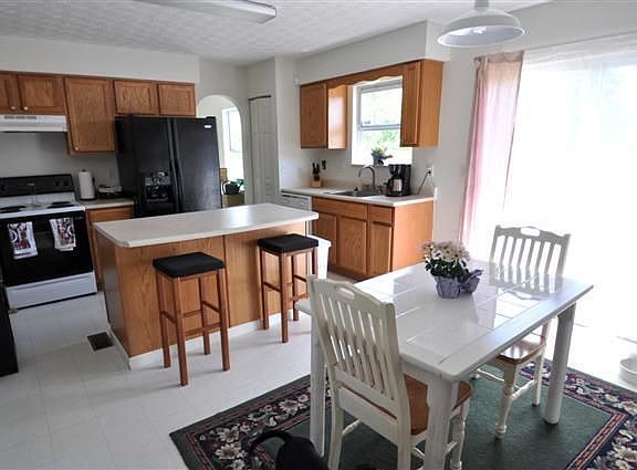 Nice sized kitchen has center island and eat in space.