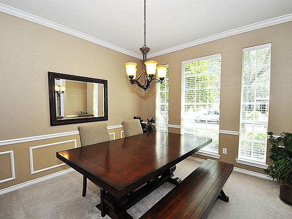 Formal dining room with decorative wall framing