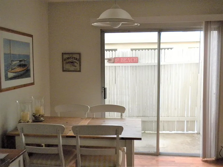 1st Level - Small fenced-in patio accessible from Dining area through sliding glass door.