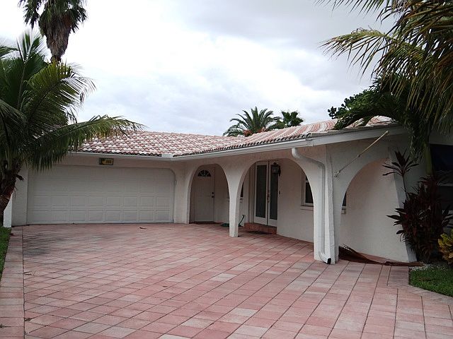 entry with pavered driveway