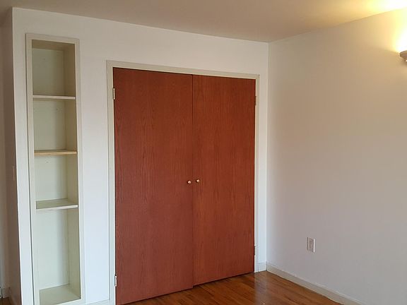 The closet and shelf space of the room with private balcony