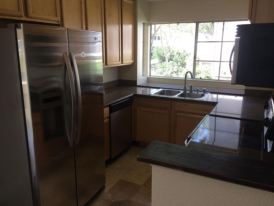 lovely granite counters and stainless appliances