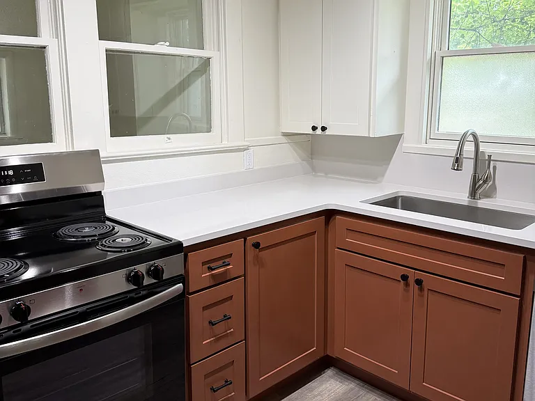 Faucet has a built in sprayer. Disposal and dishwasher included.