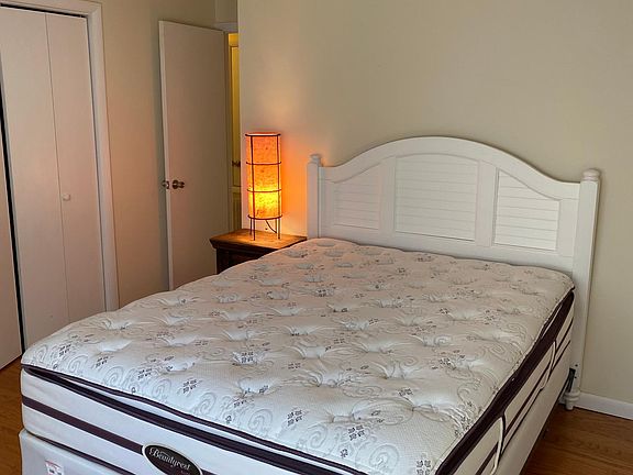 1st bedroom faces parking lot and gets lots of sun. This bedroom has very big closets and very comfortable bed.