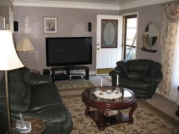 The spacious living room has been recently painted.