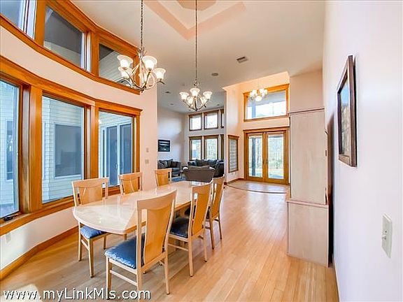 Dining area with view of front entryway & living room