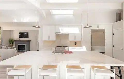Oversized kitchen island with 3 skylights above