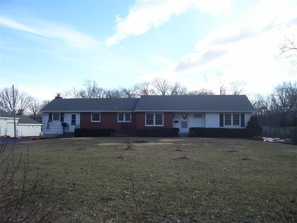 View from the street, there are blueberry plants in the front yard.