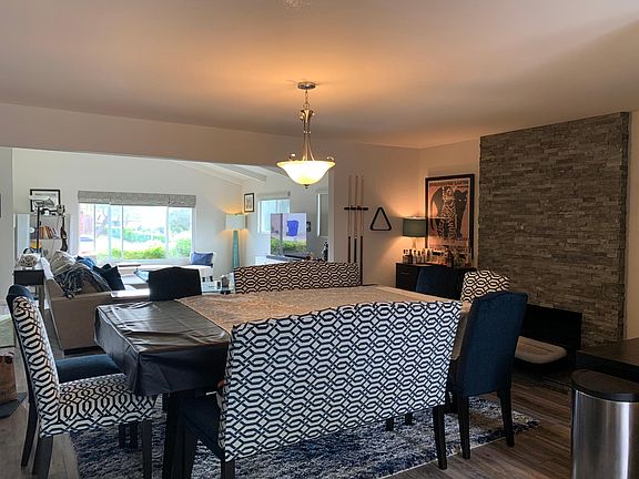 View from kitchen through dining room to front of house.