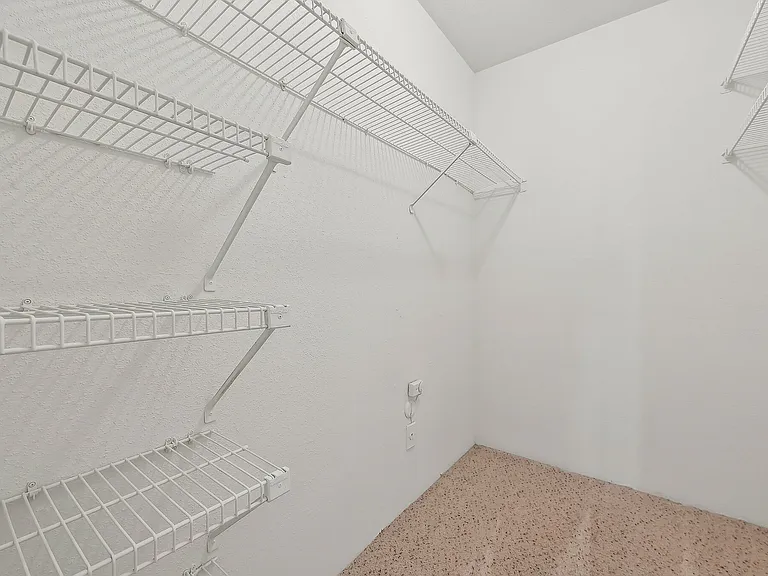 Spacious walk-in closet with wire shelving at Driscoll Place Apartments