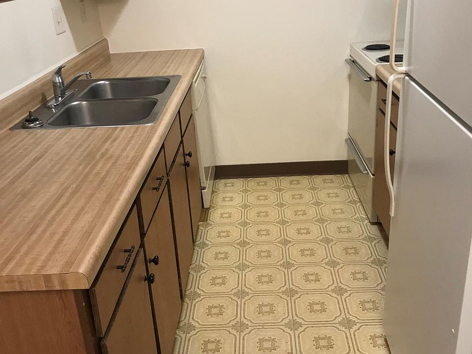 Functional kitchen with dishwasher, plenty of cabinet space and refrigerator.
