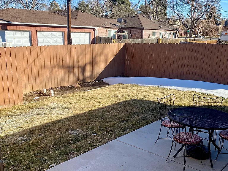 Patio and private back yard. The yard is watered by sprinkling system