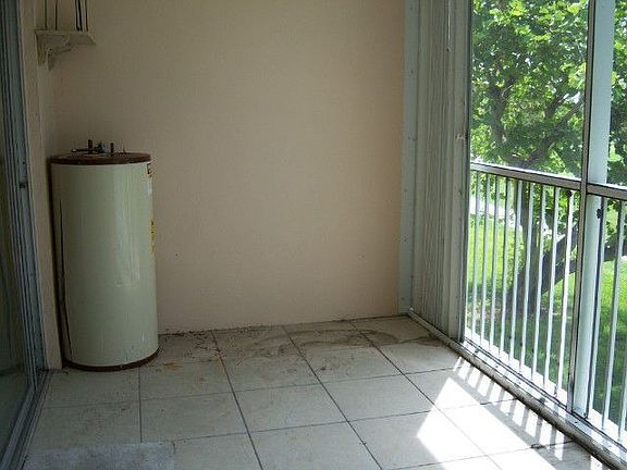 Screene Covered Patio with Shutters