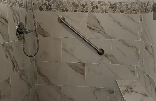 Custom Shower, built in seat, pebble floor & accents