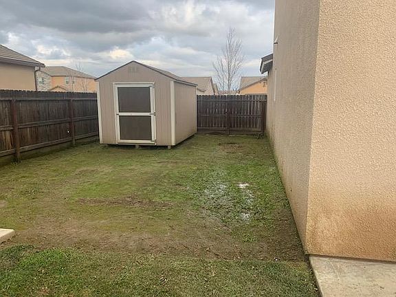 large side yard with shed for extra storage