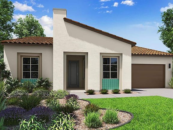 Elevation A features the spanish exterior style. Shown with Optional Golf Cart Garage