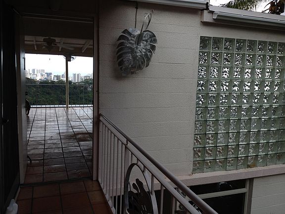 Entrance to apartment with glass block wall