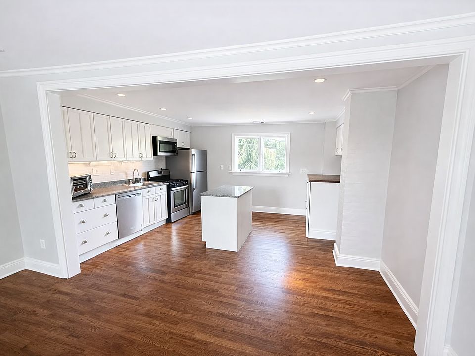 Open kitchen with stainless steel appliances