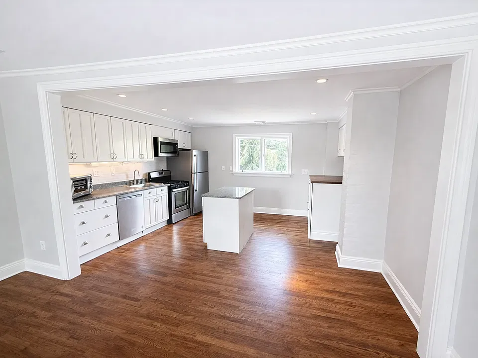 Open kitchen with stainless steel appliances