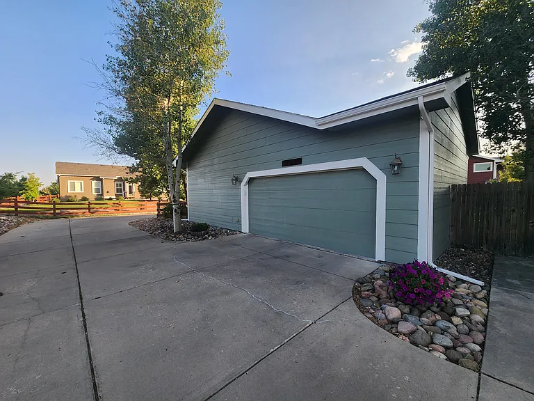 Garage view with adjacent parking